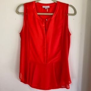 1. State vibrant orange blouse size M